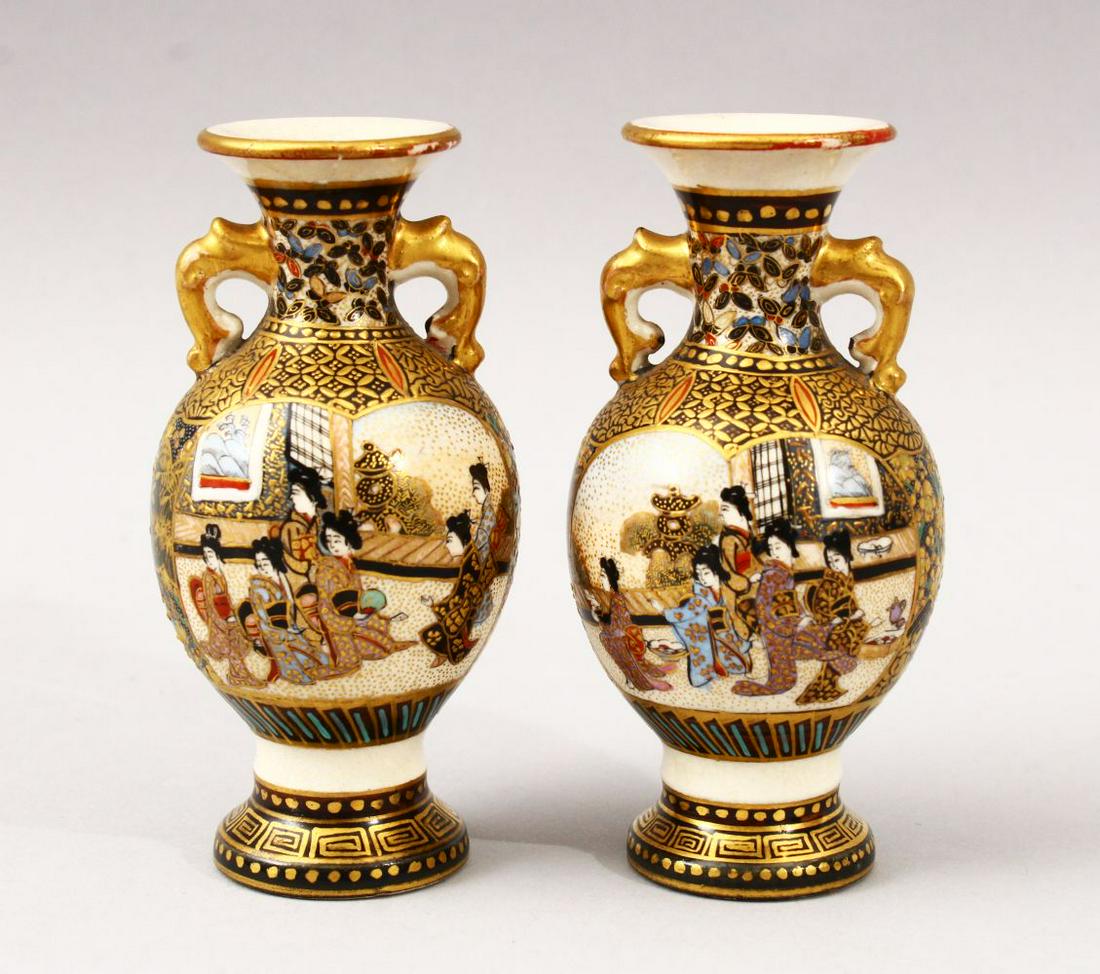 A GOOD PAIR OF SMALL JAPANESE MEIJI PERIOD SATSUMA TWIN: A GOOD PAIR OF SMALL JAPANESE MEIJI PERIOD SATSUMA TWIN HANDLE VASES, with panel decoration depicting figures in landscape scenes, further decorated with butterflies and geometric floral form borders,
