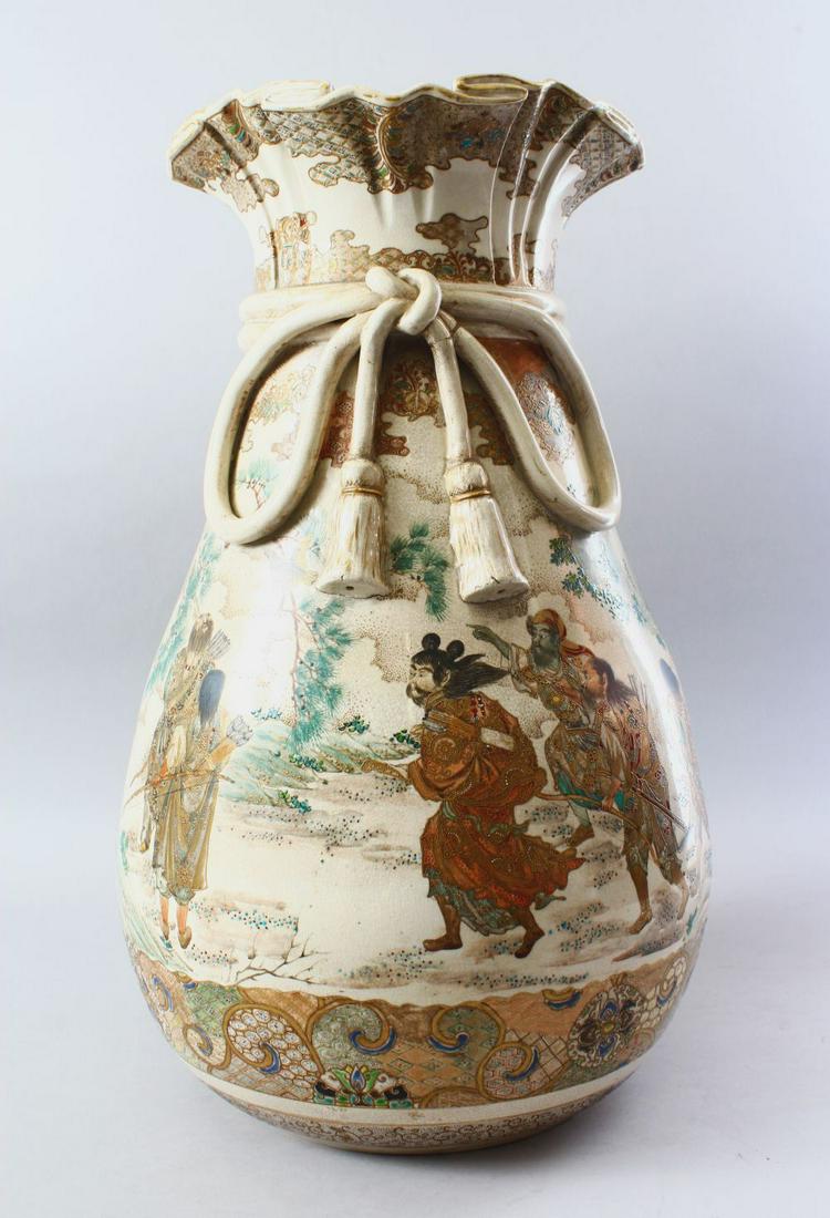 A LARGE JAPANESE MEIJI PERIOD SATSUMA VASE IN THE FORM: A LARGE JAPANESE MEIJI PERIOD SATSUMA VASE IN THE FORM OF A TIED SACK, the body of the large vase with applied moulded and gilded rope decoration below a flared rim, the main decoration of warriors ap