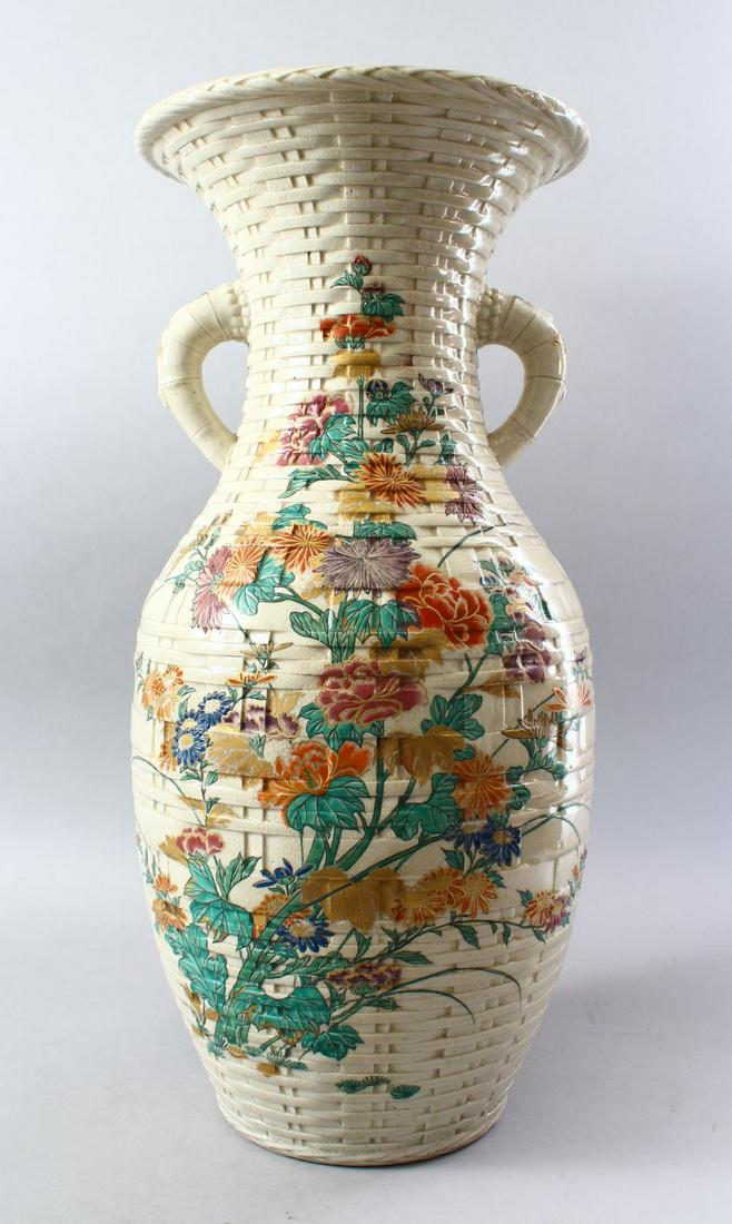 A LARGE UNUSUAL JAPANESE MEIJI PERIOD BASKET WEAVE: A LARGE UNUSUAL JAPANESE MEIJI PERIOD BASKET WEAVE SATSUMA VASE, the body with basket weave decoration and twin moulded handles, the main section with an elaborate sprays of native flora to both sides