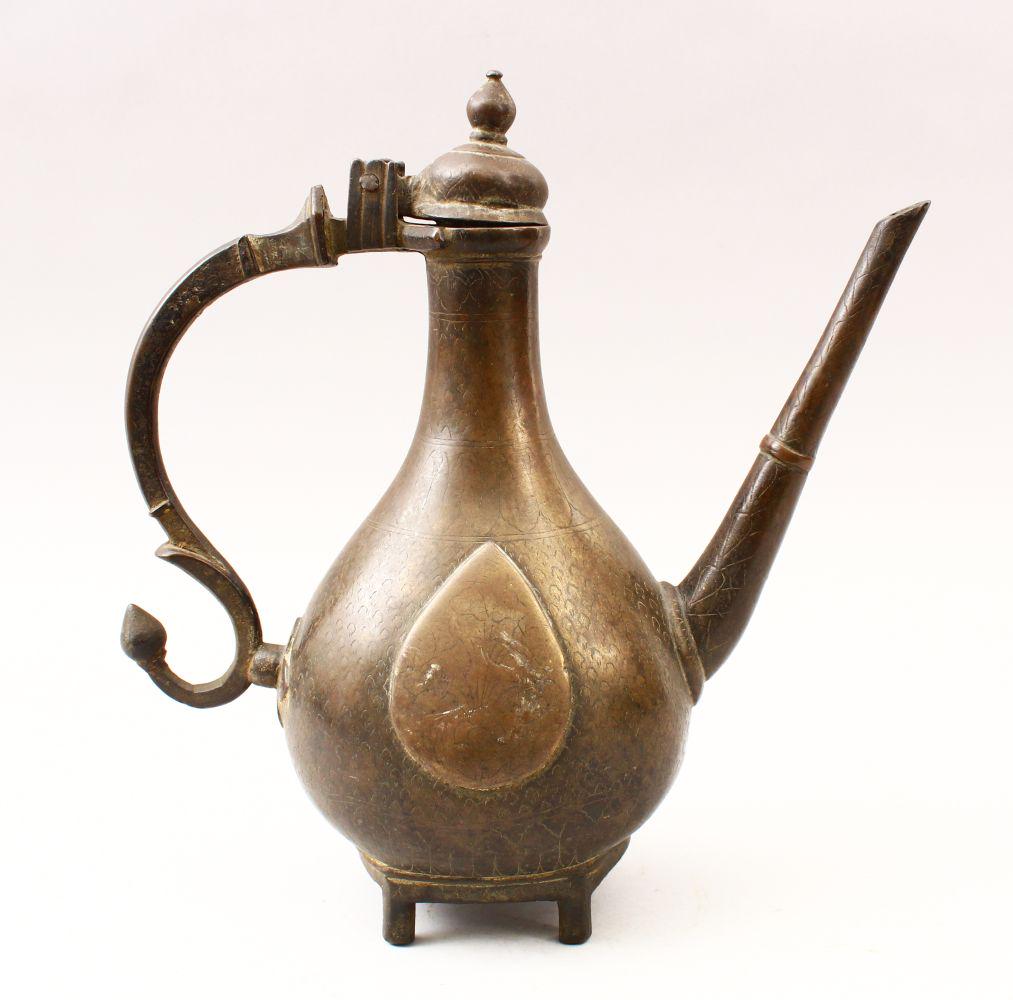 A GOOD 19TH CENTURY ISLAMIC BRONZE LIDDED EWER, with a (1 of 5)
