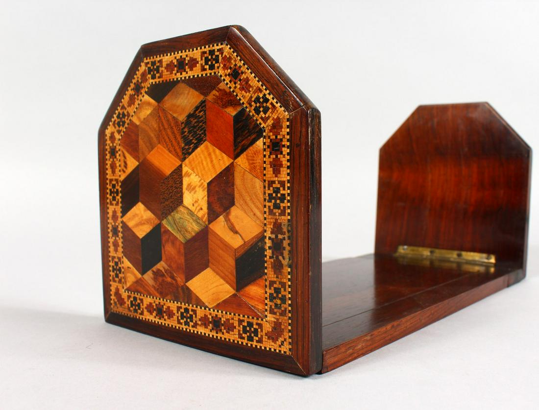 A TUNBRIDGE WARE SLIDING BOOK STAND, the folding sides: A TUNBRIDGE WARE SLIDING BOOK STAND, the folding sides with parquetry, the other inlaid with a rose. 10.5ins long closed.