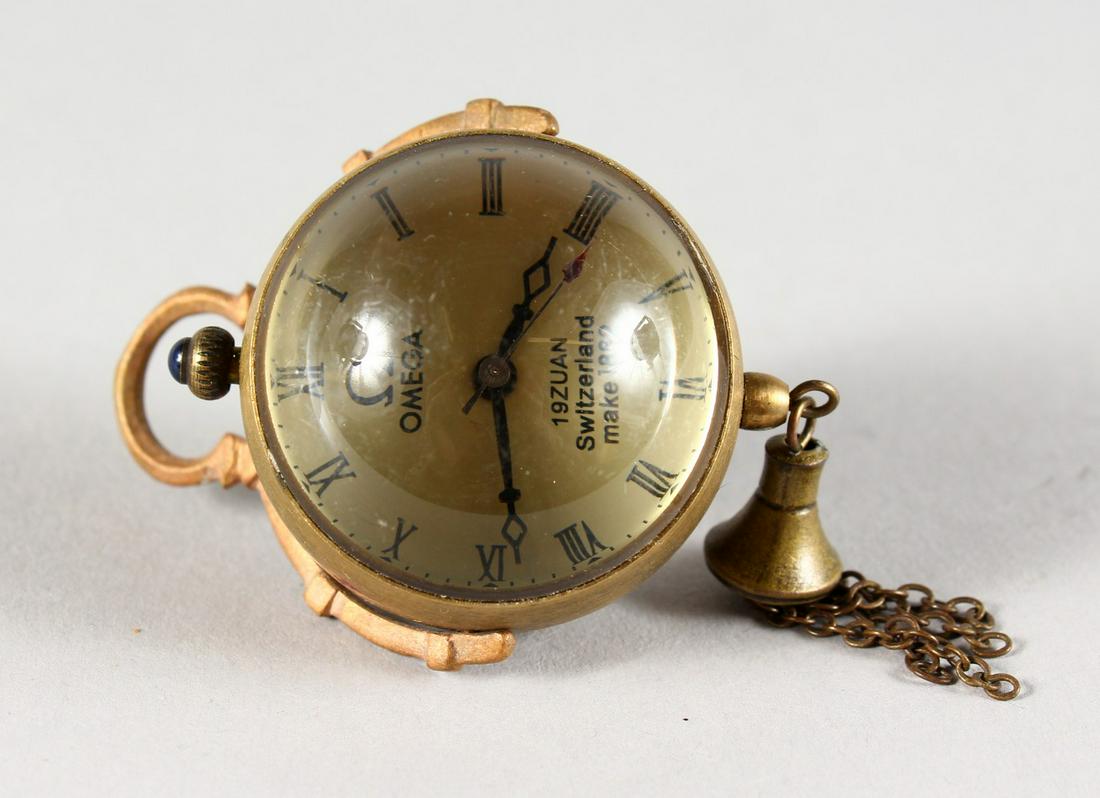 A SMALL OMEGA CLEAR BALL PENDANT WATCH. 1.25ins: A SMALL OMEGA CLEAR BALL PENDANT WATCH. 1.25ins diameter.
