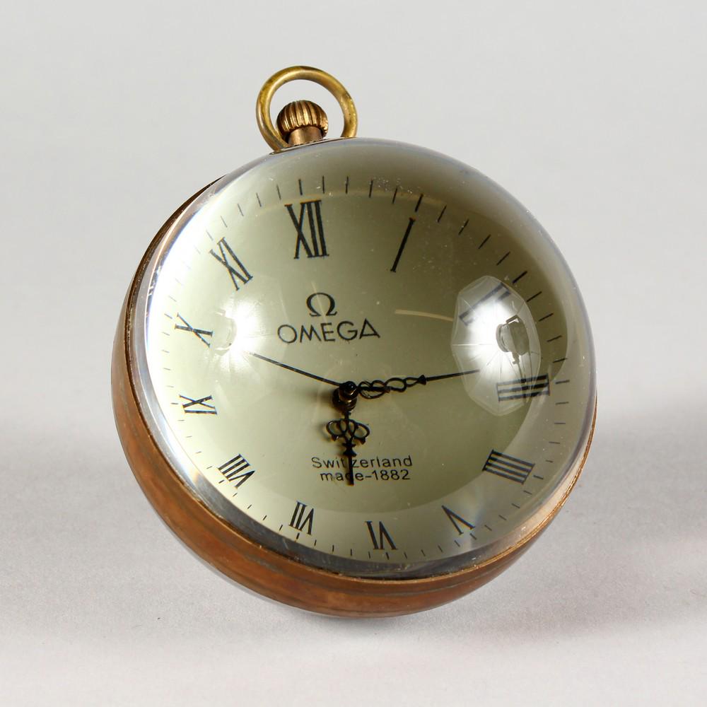 A LARGE OMEGA STYLE GLASS BALL WATCH, with open face: A LARGE OMEGA STYLE GLASS BALL WATCH, with open face and movement. 3ins diameter.