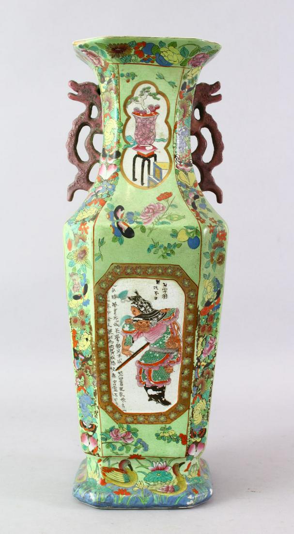 A 19TH CENTURY CHINESE FAMILLE ROSE PORCELAIN SQUARE: A 19TH CENTURY CHINESE FAMILLE ROSE PORCELAIN SQUARE FORM TWIN HANDLE VASE, the square form body with panels of warriors and calligraphy with smaller floral panels, upon a green glaze, further decorat
