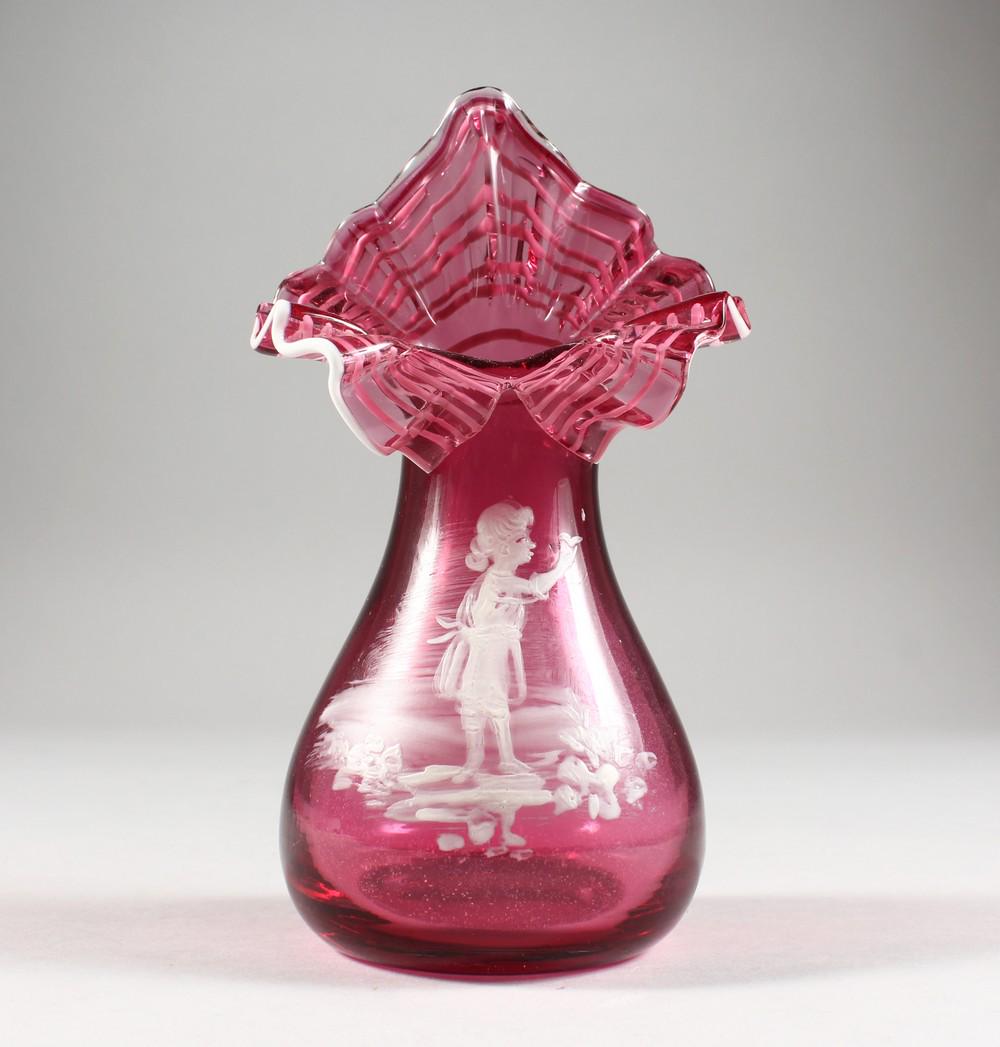 A CRANBERRY MARY GREGORY VASE.: A CRANBERRY MARY GREGORY VASE.