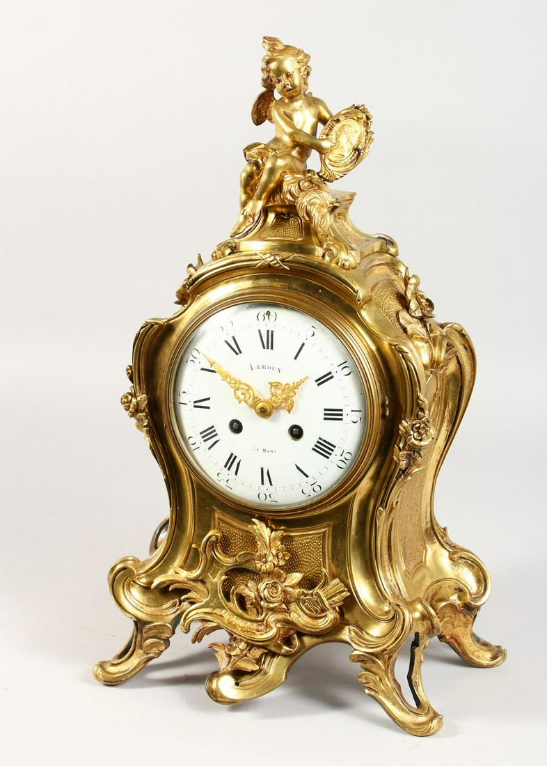 A GOOD LOUIS XVI HEAVY ORMOLU CLOCK by LEROUX, LE MANS,: A GOOD LOUIS XVI HEAVY ORMOLU CLOCK by LEROUX, LE MANS, the case with cupids, scrolls, acanthus and flowers, with an eight-day movement, enamel dial and striking on a single bell. 18ins high.