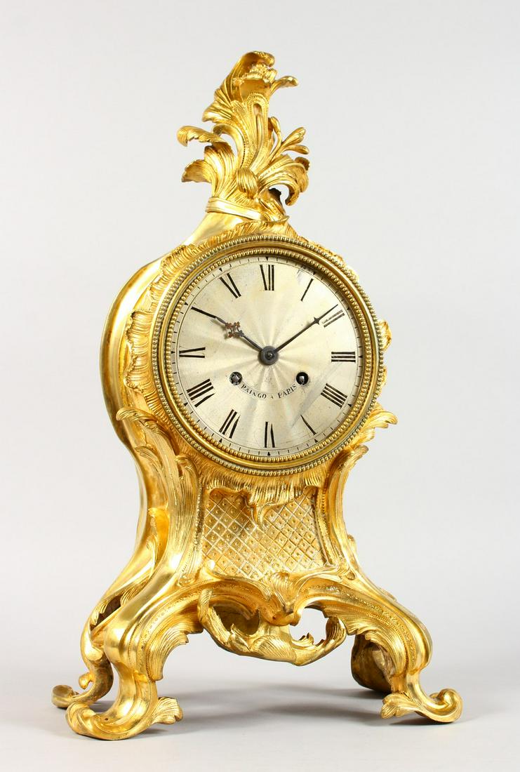 A VERY GOOD 19TH CENTURY FRENCH ORMOLU CASED CLOCK by: A VERY GOOD 19TH CENTURY FRENCH ORMOLU CASED CLOCK by RAINGO A. PARIS, eight-day movement, striking on a single bell, with silvered dial and black Roman numerals. 21ins high.