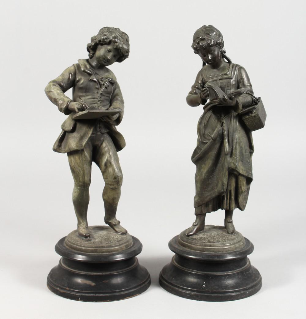 A PAIR OF 19TH CENTURY METAL STRIDING FIGURES, a young: A PAIR OF 19TH CENTURY METAL STRIDING FIGURES, a young scribe, on circular bases. 13ins high.