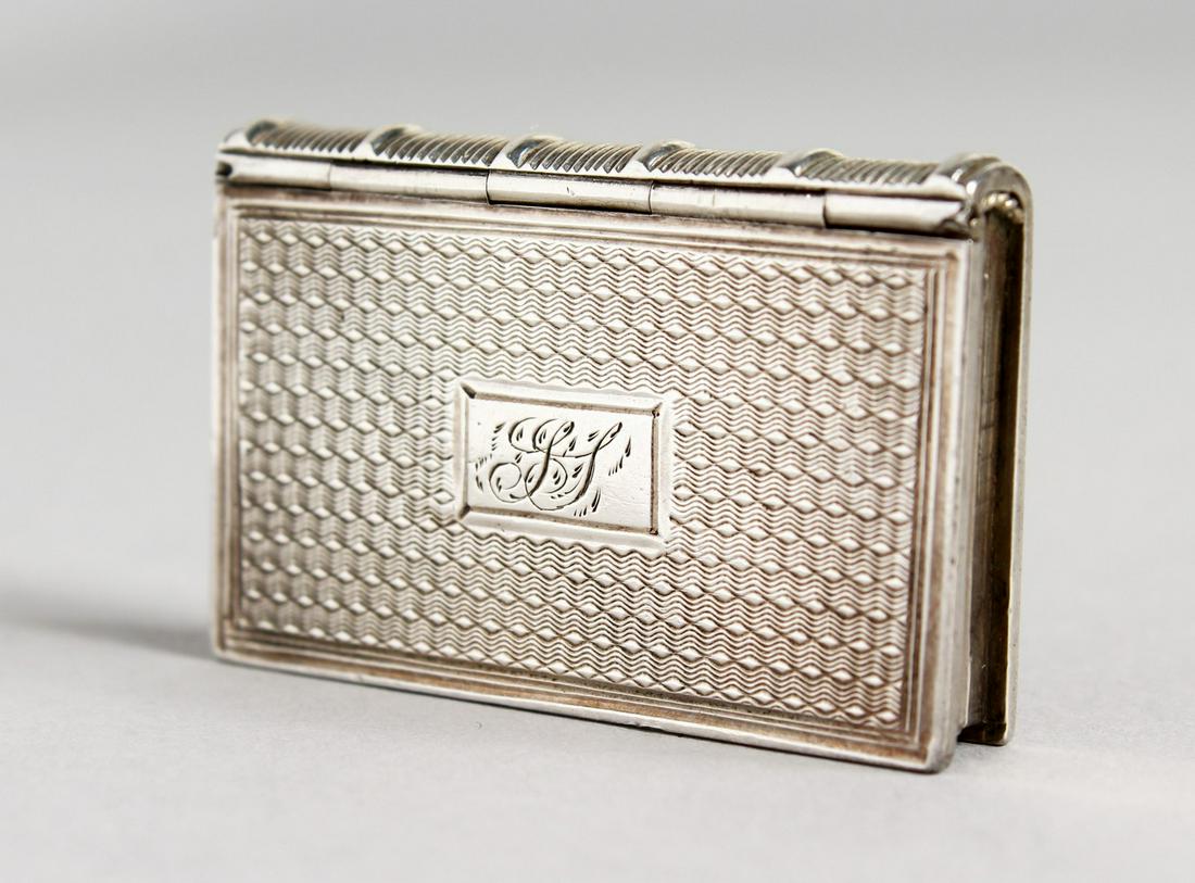 A WILLIAM IV ENGINE TURNED VINAIGRETTE, formed as a: A WILLIAM IV ENGINE TURNED VINAIGRETTE, formed as a book. Birmingham 1829-1830. Maker: Taylor & Perry.