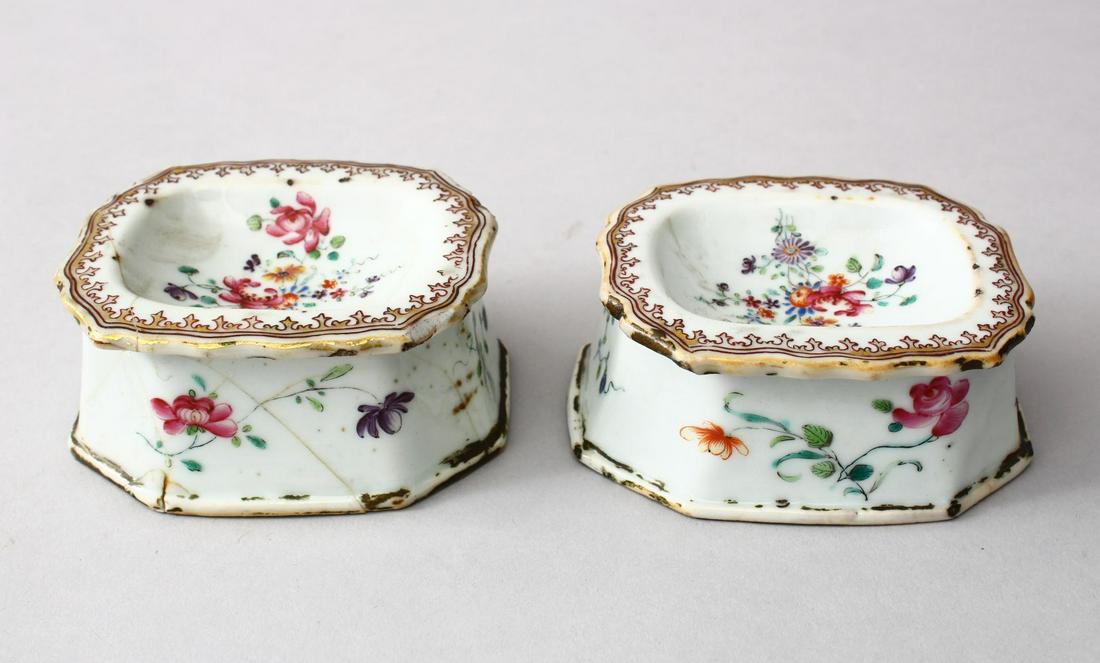 A PAIR OF 18TH CENTURY CHINESE FAMILLE ROSE PORCELAIN: A PAIR OF 18TH CENTURY CHINESE FAMILLE ROSE PORCELAIN SALT DISHES, the dishes each decorated with scenes of native flora with gilt border decoration, 3.5cm high x 9cm wide x 7cm deep.