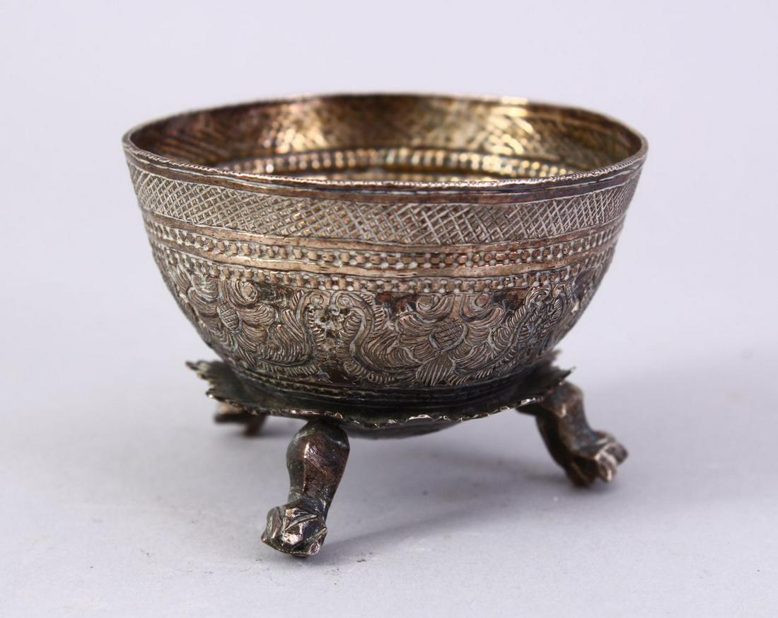 A SMALL THAI EMBOSSED SILVER BOWL, on three feet, 6cm (1 of 6)