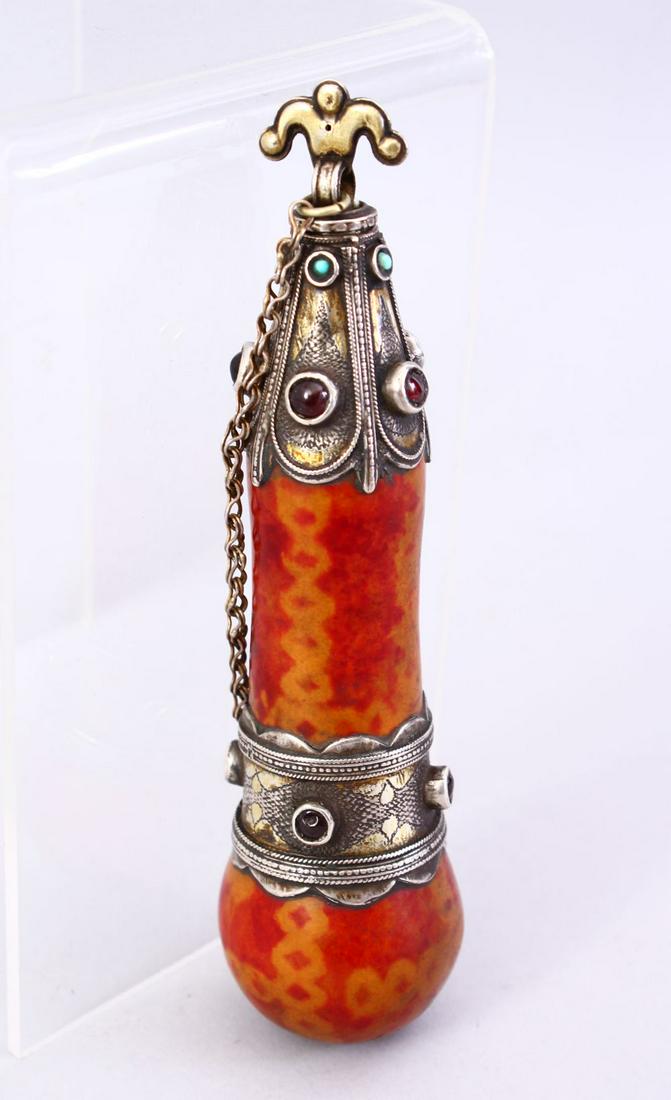 A 19TH CENTURY TURKMAN SILVER MOUNTED POWDER FLASK, (1 of 5)