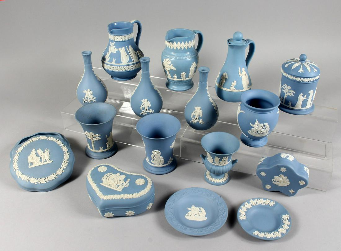 A COLLECTION OF SIXTEEN PIECES OF PALE BLUE AND WHITE: A COLLECTION OF SIXTEEN PIECES OF PALE BLUE AND WHITE JASPER WARE BOTTLES.