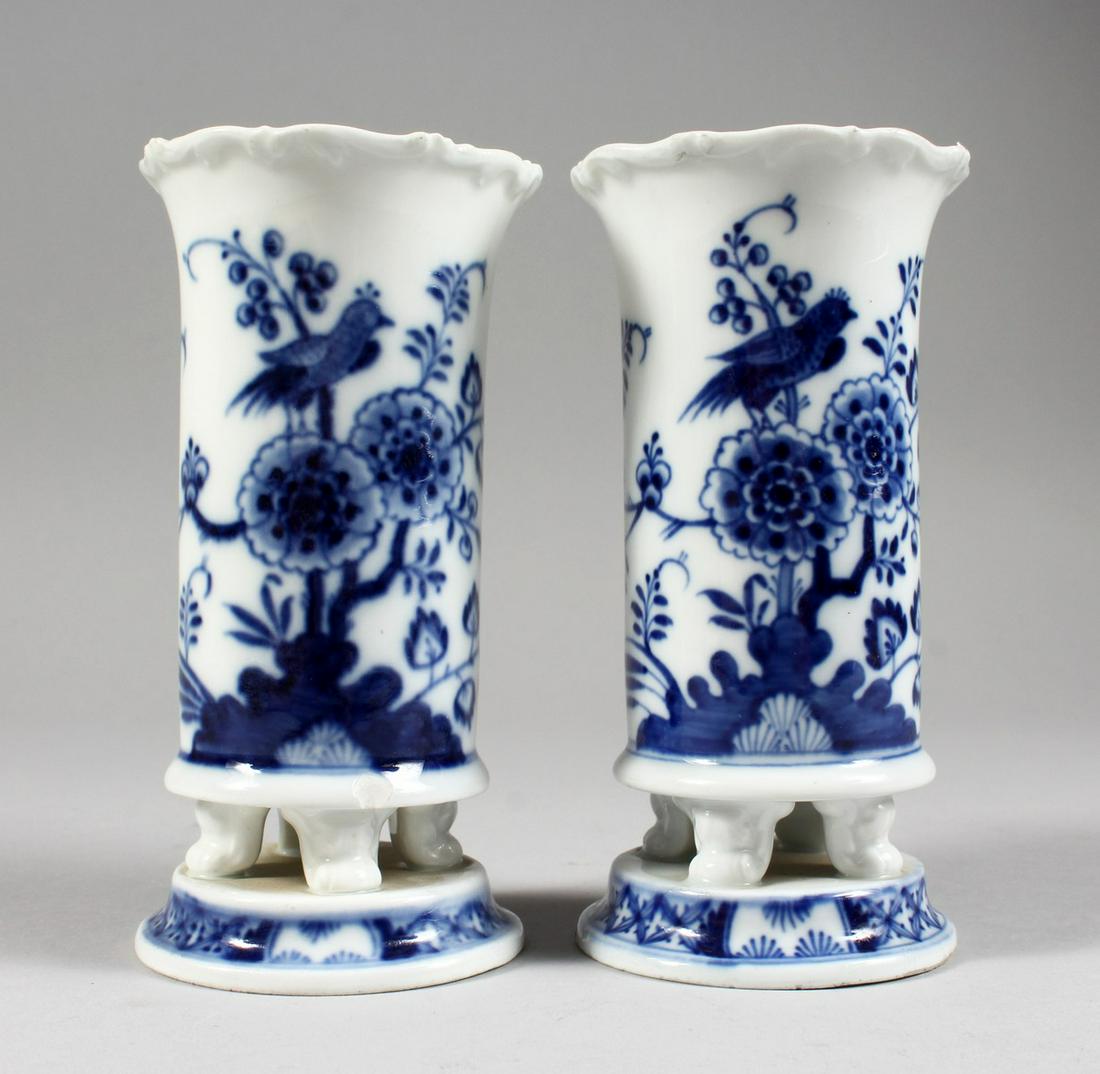 A SMALL PAIR OF MEISSEN PORCELAIN BLUE AND WHITE VASES,: A SMALL PAIR OF MEISSEN PORCELAIN BLUE AND WHITE VASES, decorated with flowers and birds. Cross swords mark in blue. 5.5ins high.