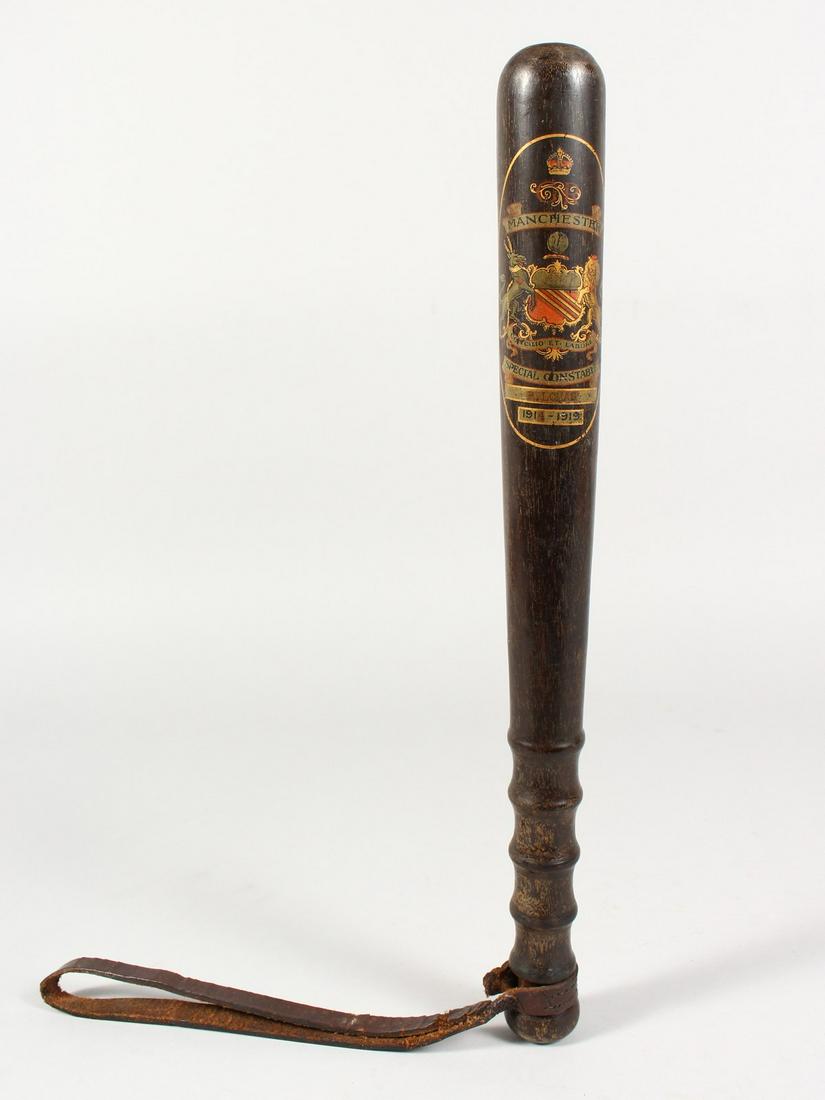A TRUNCHEON - "MANCHESTER SPECIAL CONSTABLE P. LOMAS: A TRUNCHEON - "MANCHESTER SPECIAL CONSTABLE P. LOMAS 1914-1919" with turned finger grip and leather strap. 15ins long.