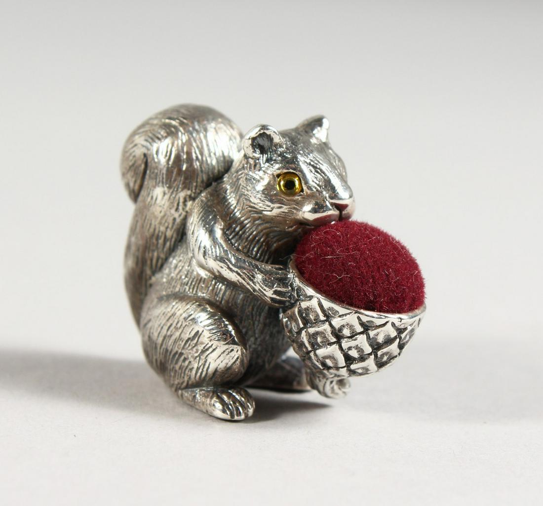 A SILVER SQUIRREL PIN CUSHION.: A SILVER SQUIRREL PIN CUSHION.