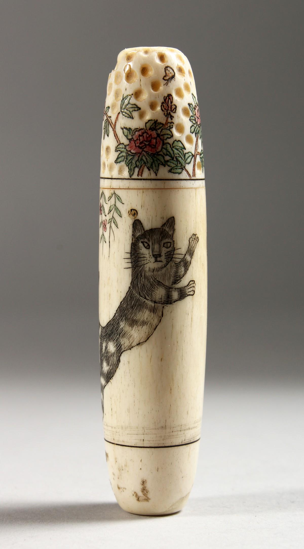 A CARVED BONE NEEDLE AND THIMBLE CASE.: A CARVED BONE NEEDLE AND THIMBLE CASE.