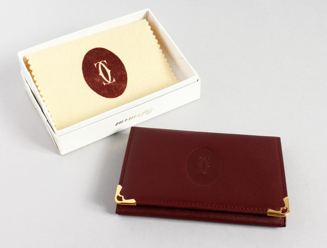 A CARTIER LEATHER WALLET in a Cartier white box.: A CARTIER LEATHER WALLET in a Cartier white box.