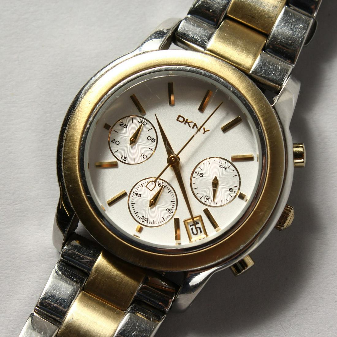 A GENTLEMAN'S DKNY WRISTWATCH with three dials and: A GENTLEMAN'S DKNY WRISTWATCH with three dials and extra links.