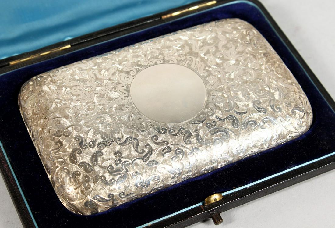 A GOOD VICTORIAN ENGRAVED SILVER CIGAR CASE in a blue: A GOOD VICTORIAN ENGRAVED SILVER CIGAR CASE in a blue case. Birmingham 1886. Maker C. C.