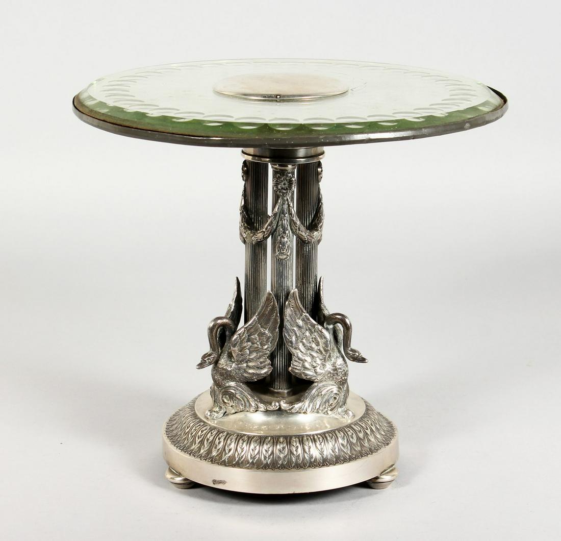 A SUPERB RUSSIAN SILVER CENTREPIECE / TAZZA with: A SUPERB RUSSIAN SILVER CENTREPIECE / TAZZA with circular glass top, 9.5ins diameter. The stand with three cast silver swans on a circular base with bun feet, 9ins high. With five marks, head and 84 4