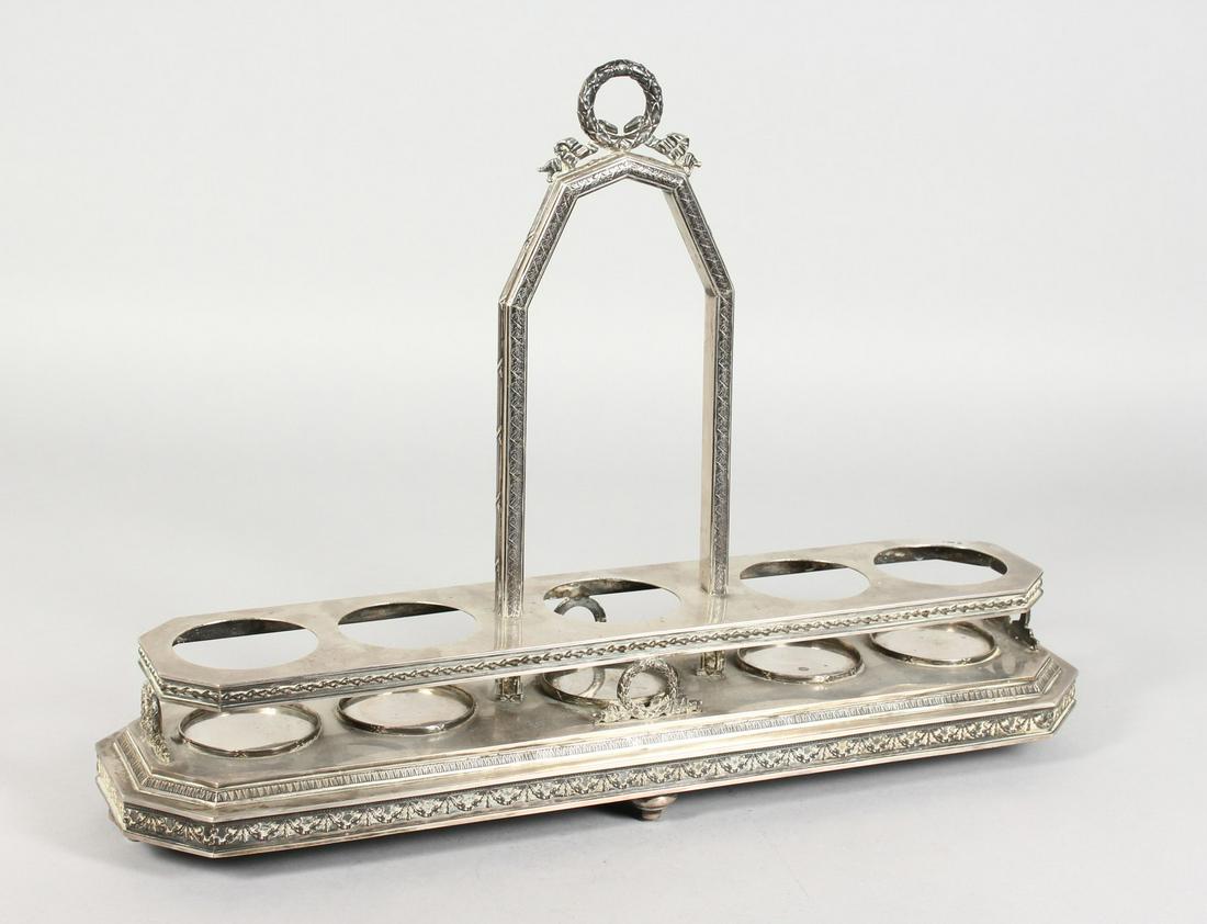 A RUSSIAN SILVER FIVE-BOTTLE STAND (NO BOTTLES) with a: A RUSSIAN SILVER FIVE-BOTTLE STAND (NO BOTTLES) with a long handle, with a wreath, the long base with four wreath supports, garlands and four bun feet. 165ins long x 4.5ins wide x 12ins high. Stamped