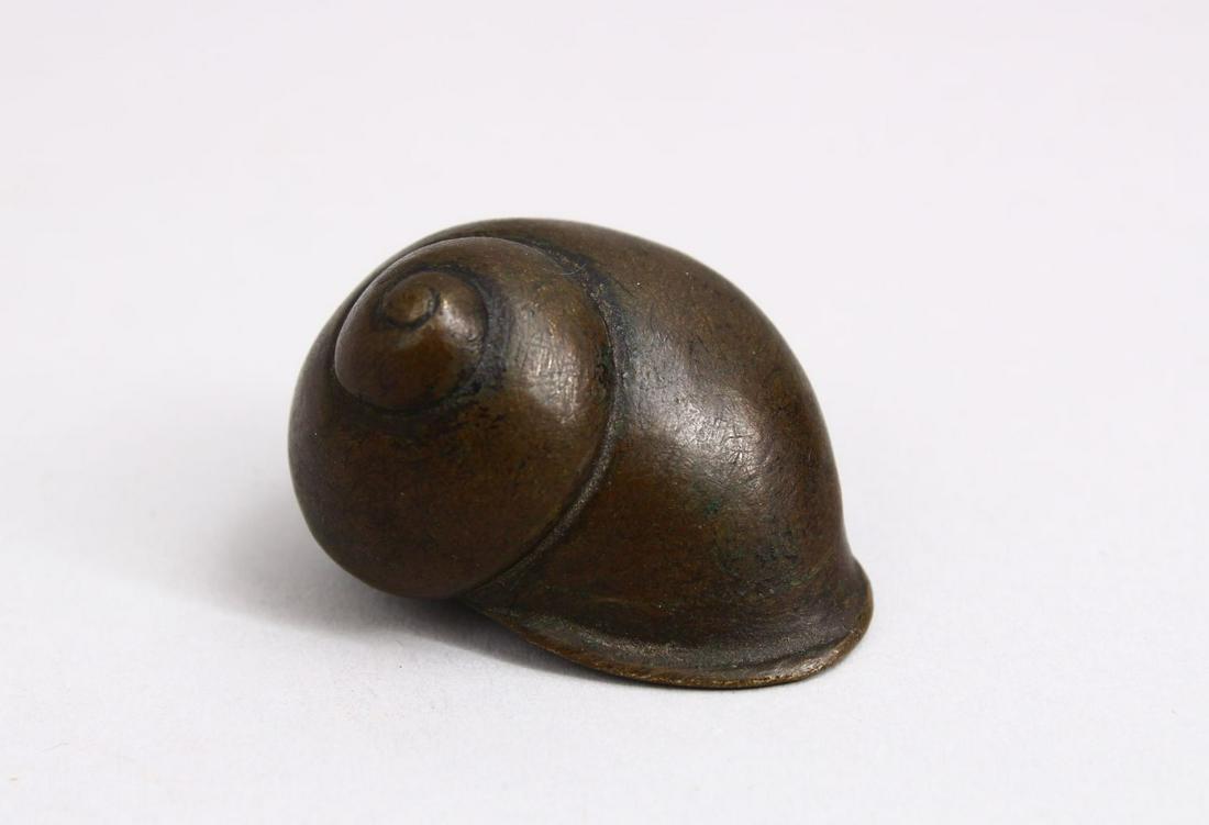 A JAPANESE BRONZE NETSUKE OF A SNAIL SHELL, 4.5cm. (1 of 3)