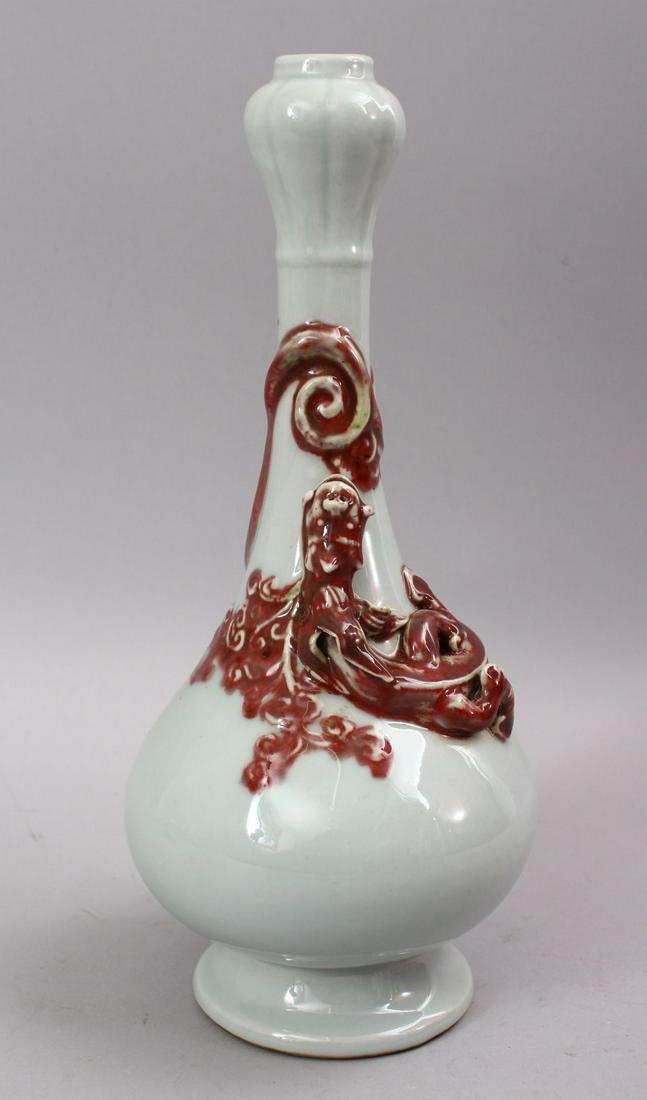 A CHINESE MING STYLE COPPER RED MOULDED PORCELAIN VASE, (1 of 7)