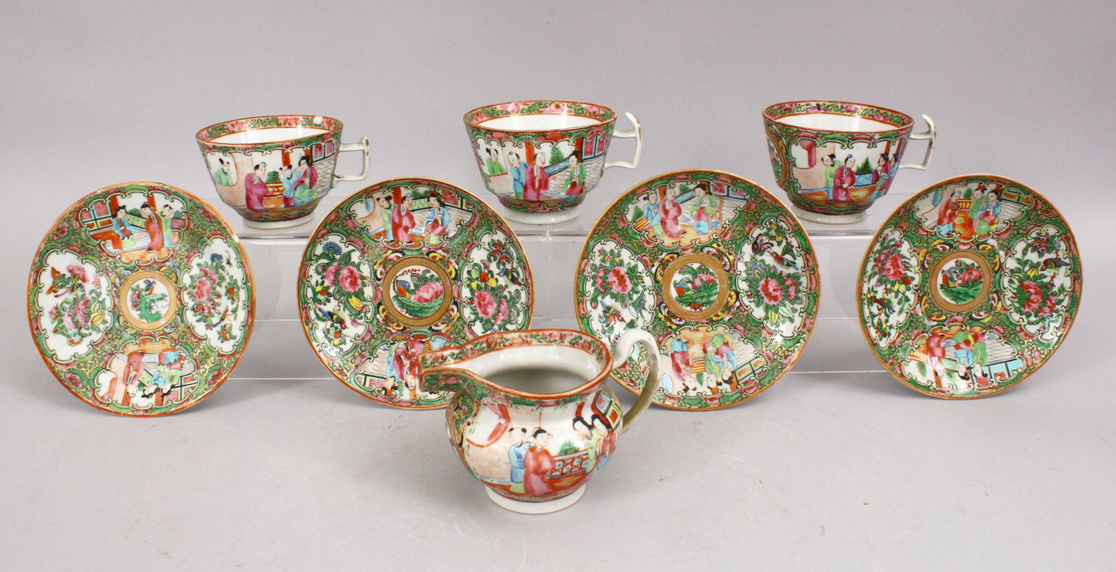 MIXED LOT OF 19TH CENTURY CHINESE CANTON FAMILLE ROSE: MIXED LOT OF 19TH CENTURY CHINESE CANTON FAMILLE ROSE PORCELAIN SAUCERS , JUG & THREE CUPS, with panel decoration of figures, butterflies, birds and flora, 4 x saucers 14.5cm, jug 13cm wide, cups 12cm