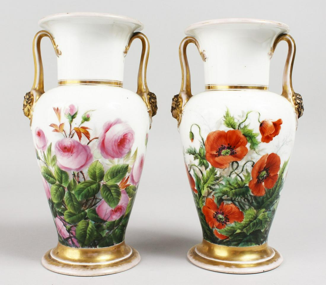 A GOOD PAIR OF BING & GRONDAHL COPENHAGEN TWO-HANDLED: A GOOD PAIR OF BING & GRONDAHL COPENHAGEN TWO-HANDLED VASE, with gilt mask handle and painted with flowers. B. & G. in blue. 8.5ins high.