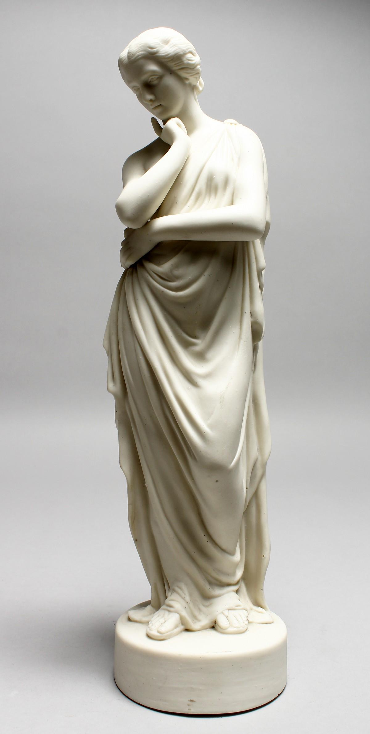 A 19TH CENTURY PARIAN CLASSICAL FEMALE FIGURE, on a: A 19TH CENTURY PARIAN CLASSICAL FEMALE FIGURE, on a circular base. 14ins high.