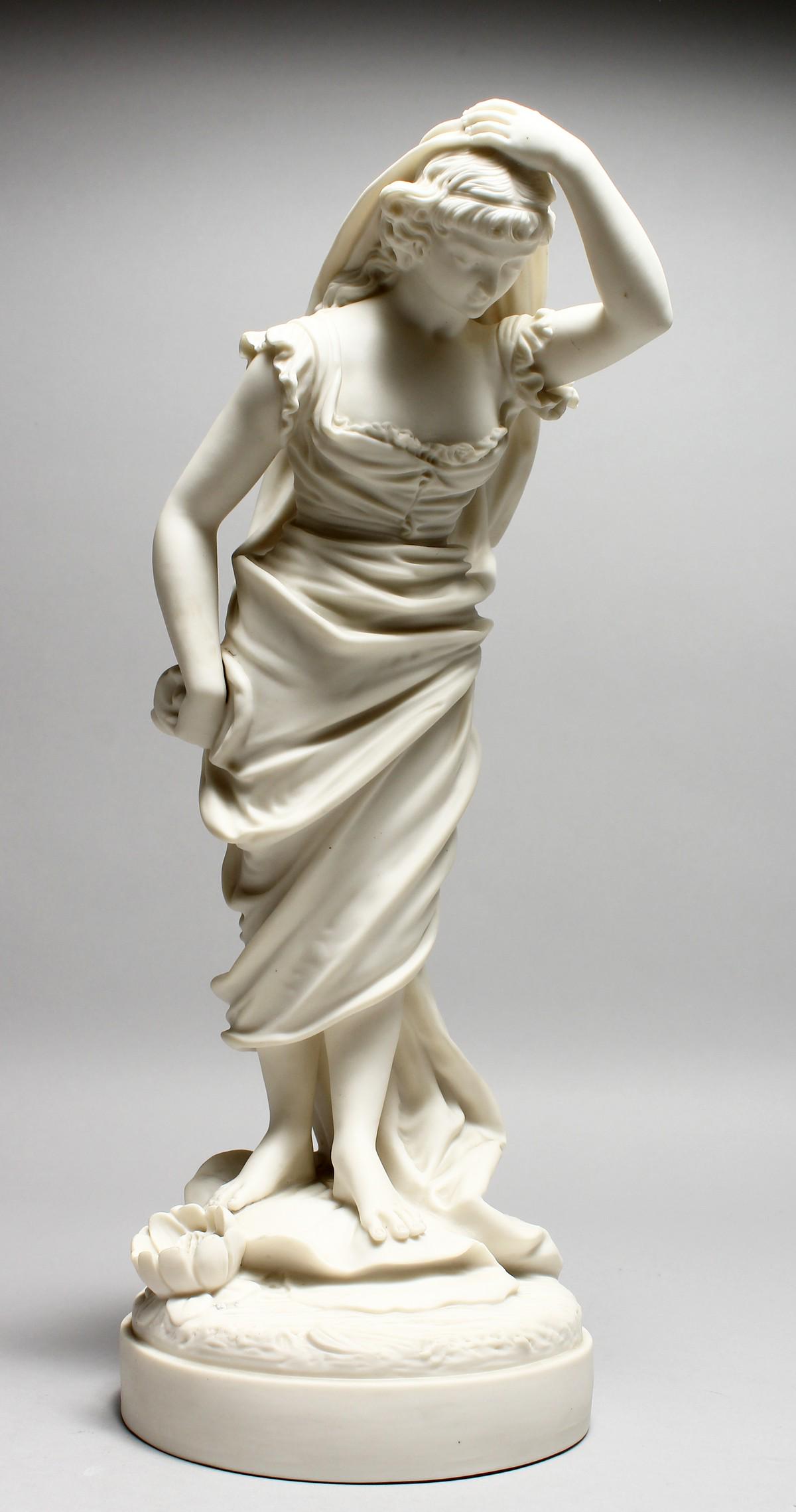 A 19TH CENTURY PARIAN FEMALE FIGURE, holding her head.: A 19TH CENTURY PARIAN FEMALE FIGURE, holding her head. 15ins high.