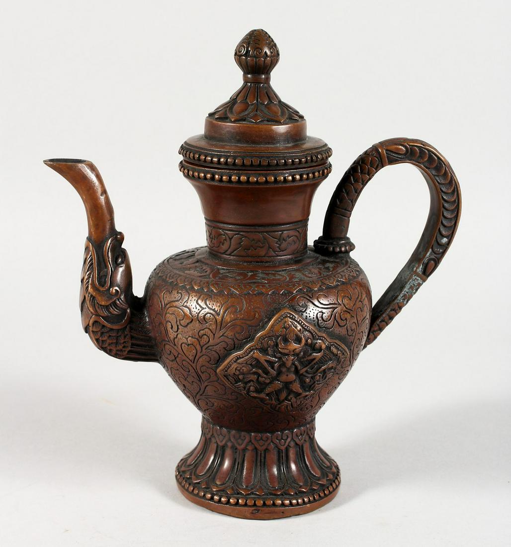 A TIBETAN COPPERED BRONZE TEAPOT. 8ins high.: A TIBETAN COPPERED BRONZE TEAPOT. 8ins high.