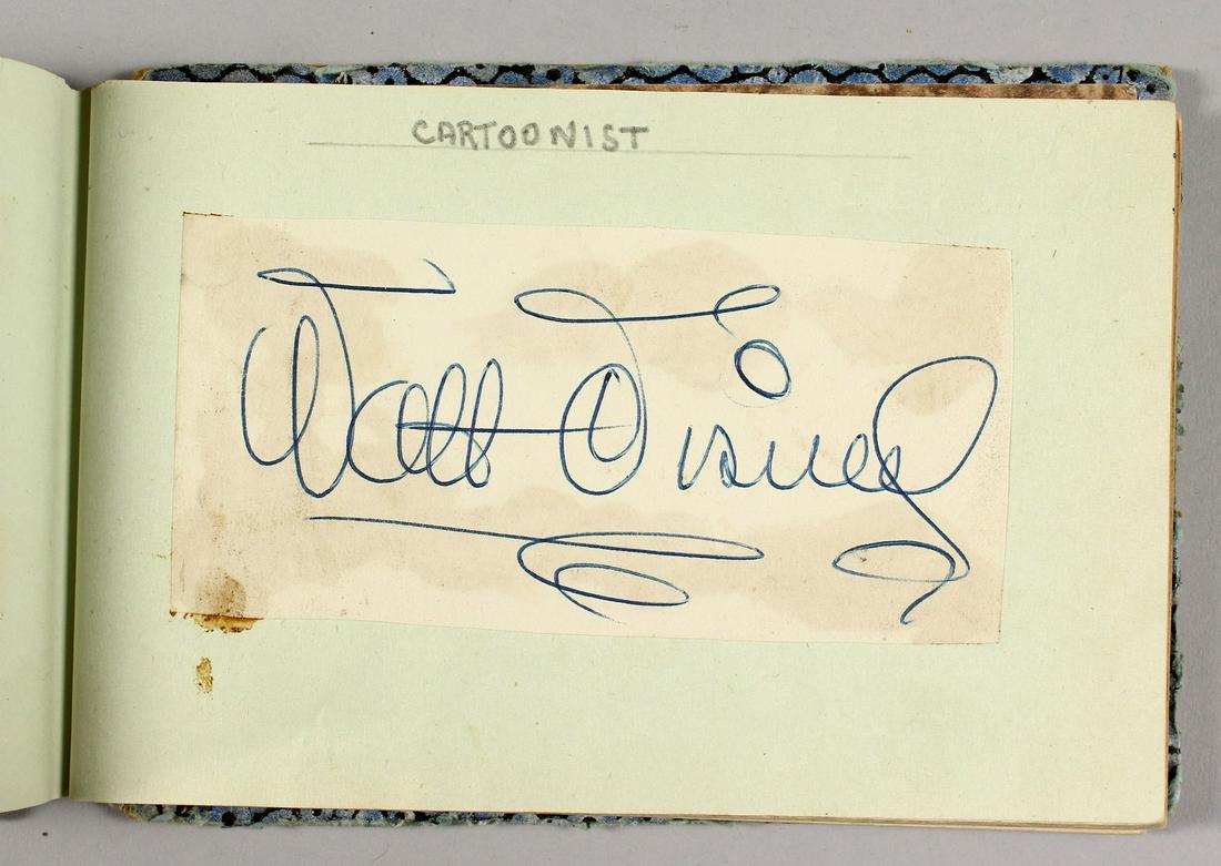 A 1952 AUTOGRAPH ALBUM, including Walt Disney, Fred: A 1952 AUTOGRAPH ALBUM, including Walt Disney, Fred Winter, Bing Crosby, Denis Compton, Clark Gable and others.