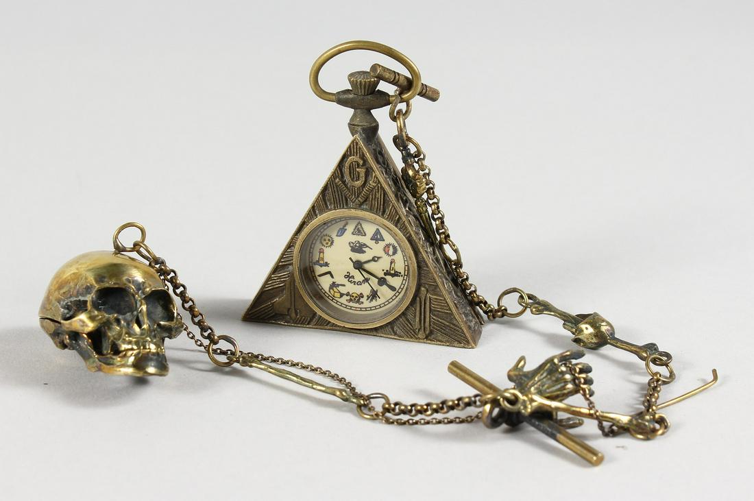 A BRASS MASONIC SKULL WATCH.: A BRASS MASONIC SKULL WATCH.