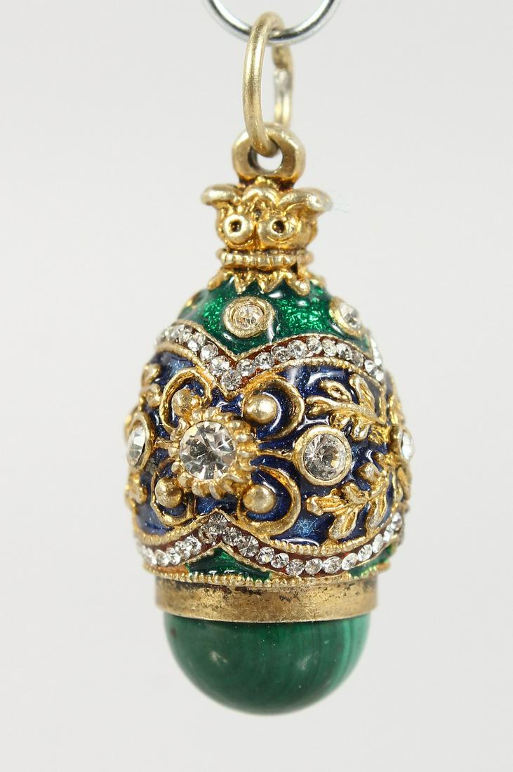 A SMALL RUSSIAN SILVER AND MALACHITE EGG SHAPE PENDANT.: A SMALL RUSSIAN SILVER AND MALACHITE EGG SHAPE PENDANT.
