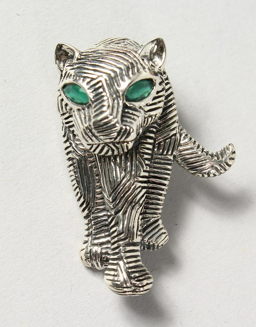 A SILVER DECO STYLE TIGER BROOCH.: A SILVER DECO STYLE TIGER BROOCH.