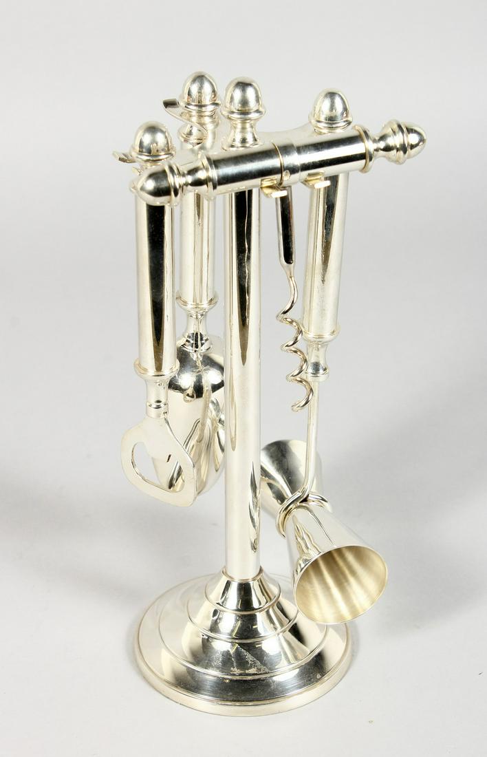 A SILVER PLATED BAR TOOLS/COCKTAIL SET. 10ins high.: A SILVER PLATED BAR TOOLS/COCKTAIL SET. 10ins high.