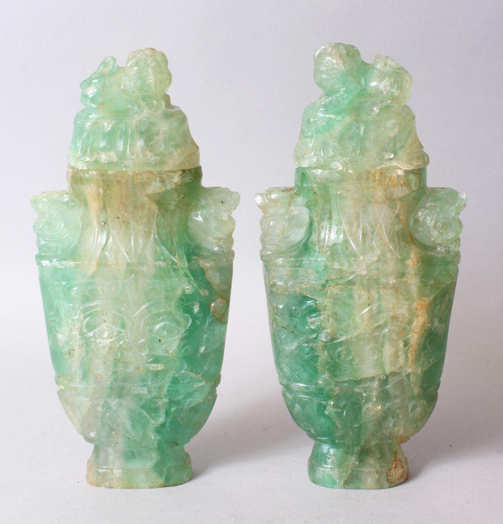 A GOOD PAIR OF CHINESE CARVED JADE LIDDED URNS, carved (1 of 3)