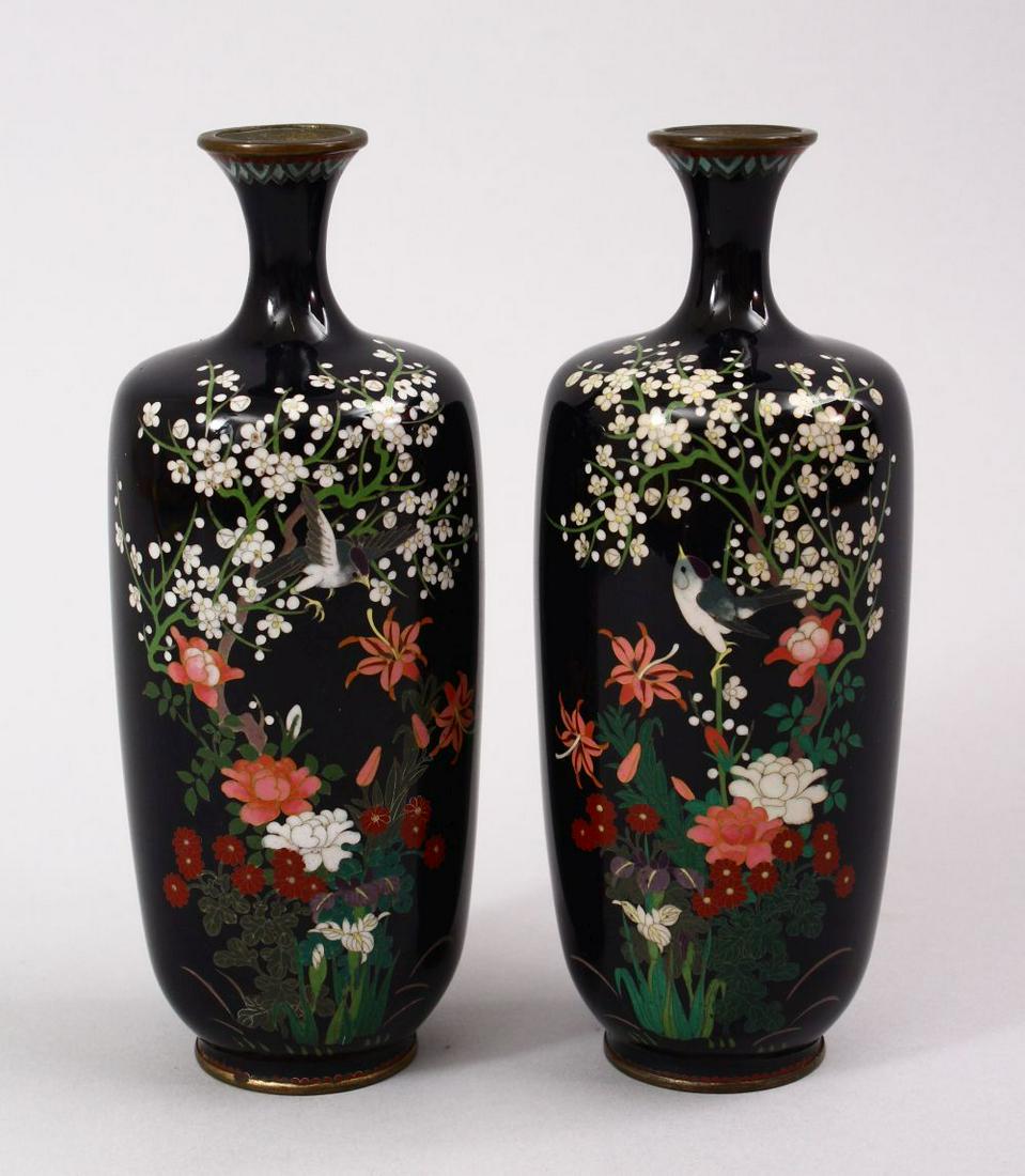 A PAIR OF JAPANESE MEIJI PERIOD CLOISONNE VASES, each: A PAIR OF JAPANESE MEIJI PERIOD CLOISONNE VASES, each with a scene of native flora with birds in flight, 15.5cm high.