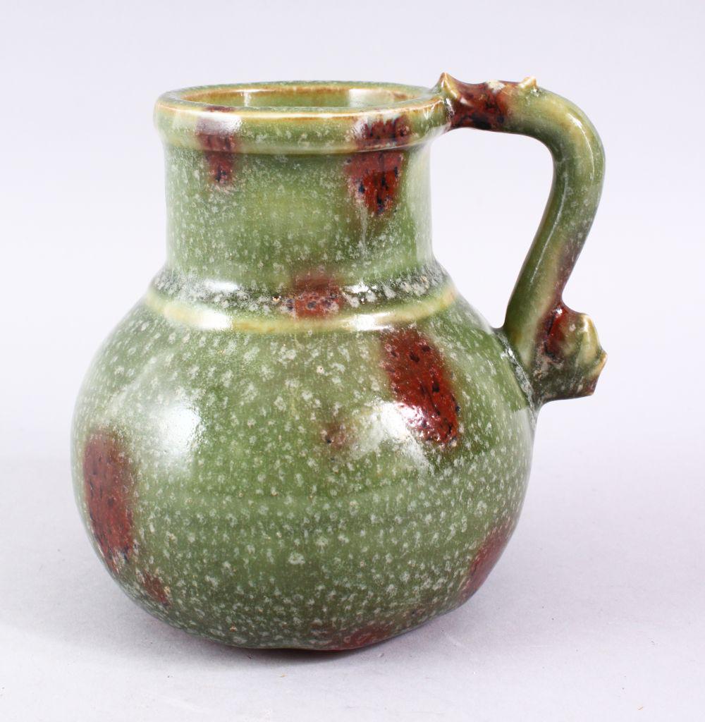 A CHINESE CELADON GLAZED POTTERY JUG FOR THE PERSIAN (1 of 7)
