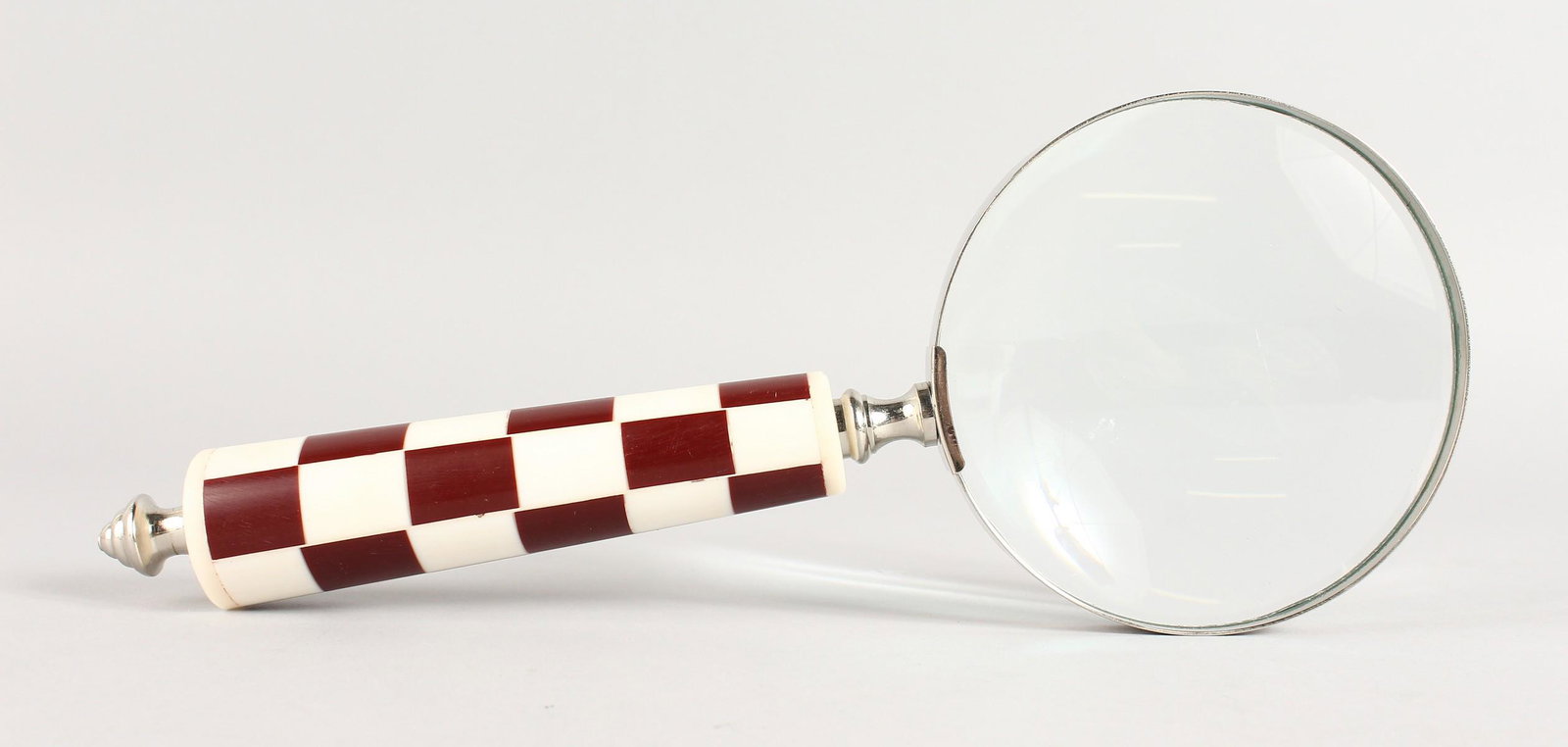A MAGNIFYING GLASS.: A MAGNIFYING GLASS.