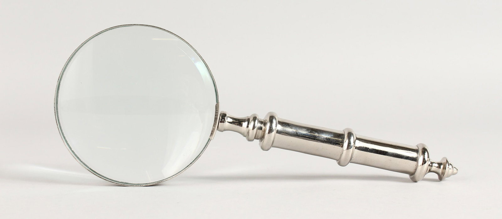 A MAGNIFYING GLASS.: A MAGNIFYING GLASS.