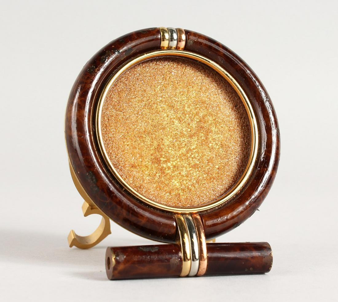A CARTIER CIRCULAR PHOTOGRAPH FRAME in a bag. 2.75ins: A CARTIER CIRCULAR PHOTOGRAPH FRAME in a bag. 2.75ins diameter.