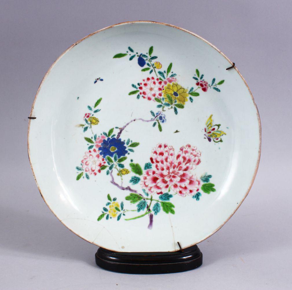 AN 18TH CENTURY CHINESE FAMILLE ROSE PORCELAIN DISH &: AN 18TH CENTURY CHINESE FAMILLE ROSE PORCELAIN DISH & STAND, decorated with native floral display, (AF) 28cm.