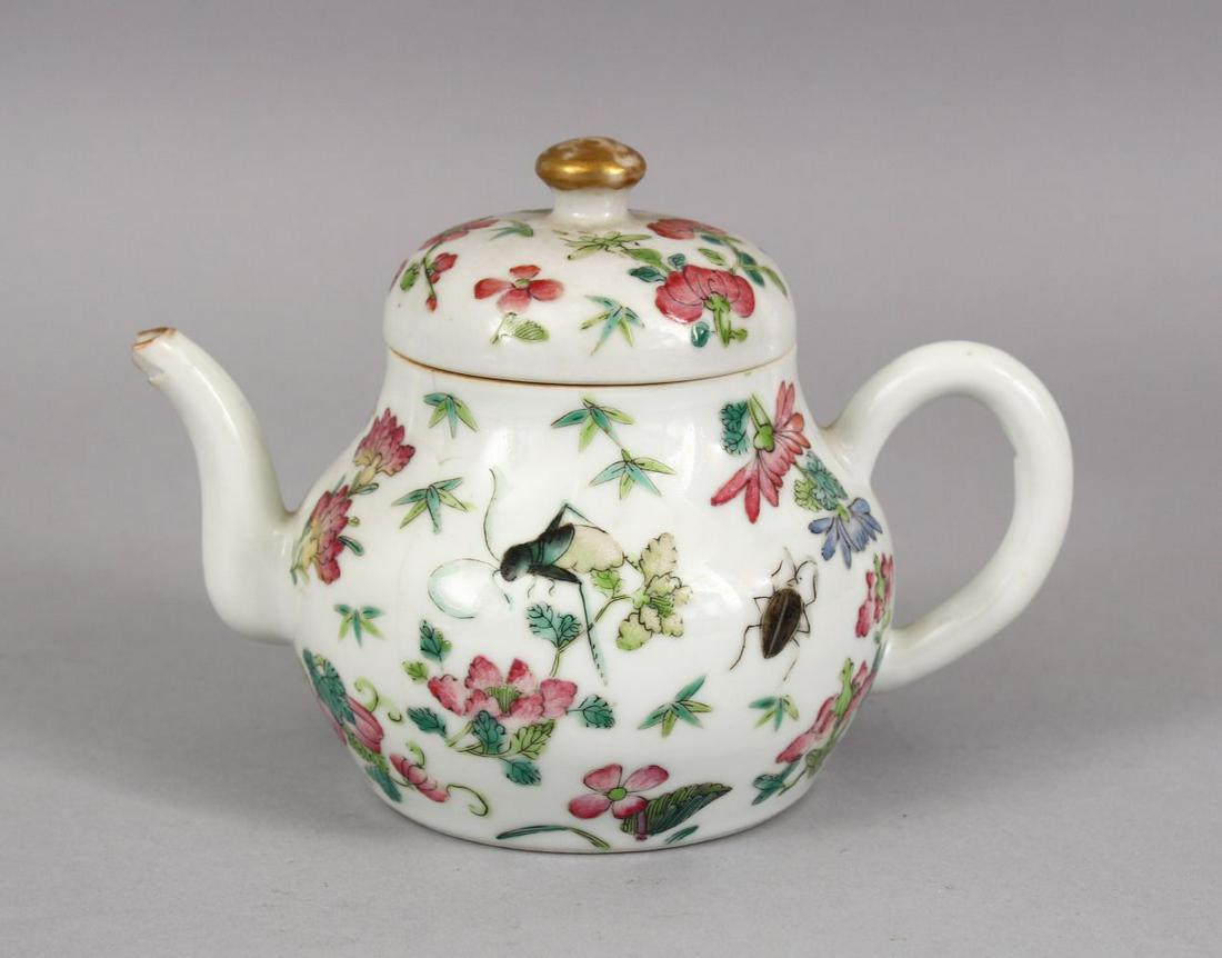 A CHINESE FAMILLE ROSE PORCELAIN TEA POT AND COVER,: A CHINESE FAMILLE ROSE PORCELAIN TEA POT AND COVER, decorated with insects and sprays of native flora, the lid with a gilded finial, 10cm x 14cm.