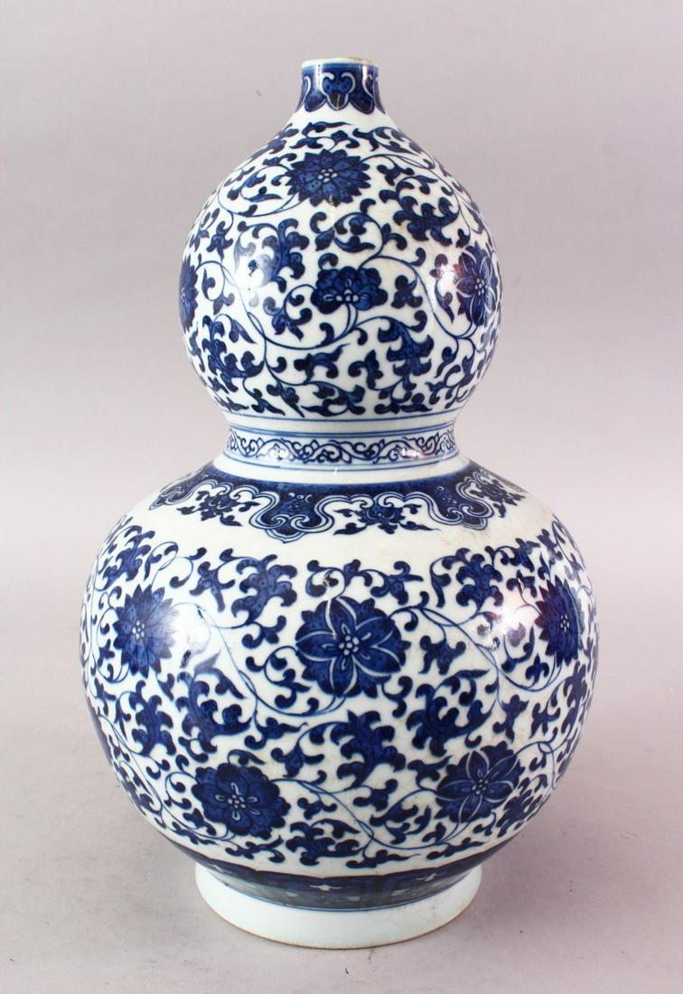 A 20TH CENTURY CHINESE MING STYLE BLUE & WHITE DOUBLE (1 of 8)