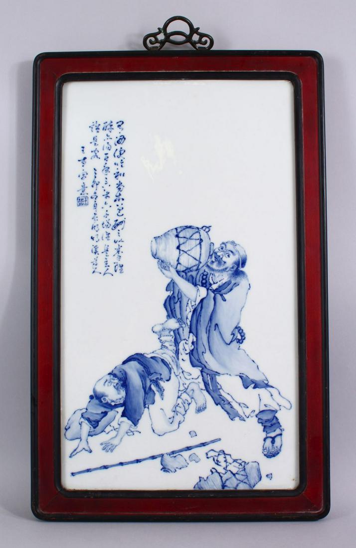 A GOOD CHINESE BLUE & WHITE PORCELAIN PANEL OF LUOHAN -: A GOOD CHINESE BLUE & WHITE PORCELAIN PANEL OF LUOHAN - AFTER WANGBU, the figures depicting drinking from a vessel whilst one is on the floor, with calligraphy upper left, in a hardwood frame and meta