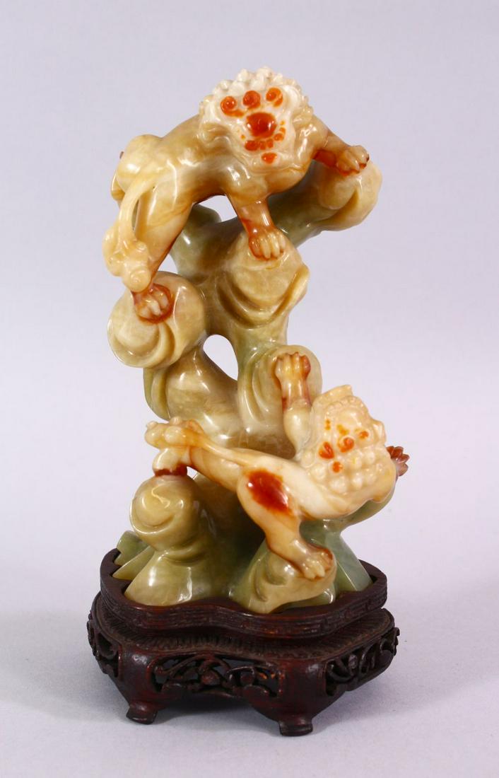 A CHINESE CARVED JADE FIGURE OF TWO LION DOGS, the dogs (1 of 7)
