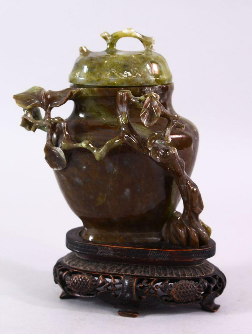 A CHINESE CARVED JADE VASE & COVER, carved with (1 of 6)